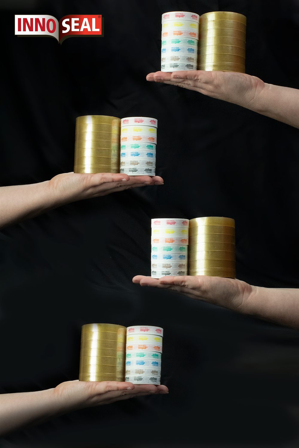 Hands holding stacks of clear tape rolls and coloured paper rolls