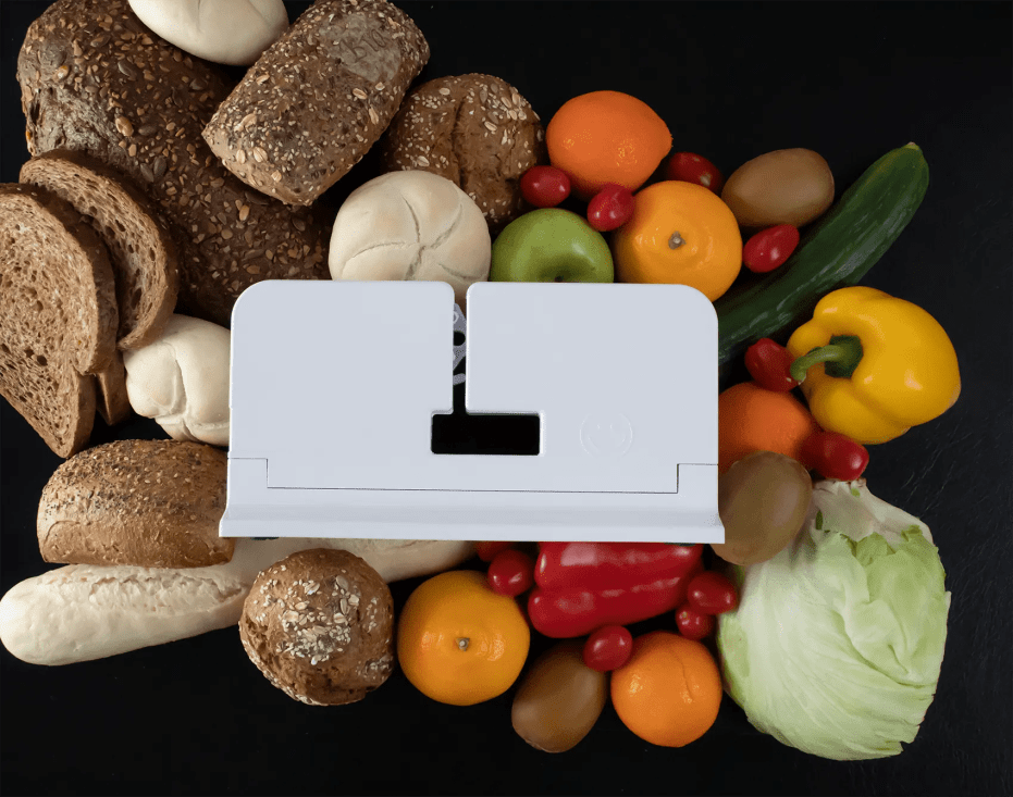 The Classic Sealer surrounded by bread, fruit and vegetables